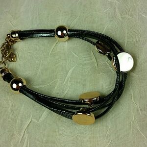 Bracelet Multiple Black cord gold tone